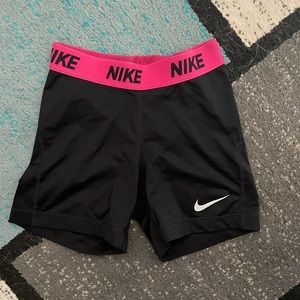 Black and pink Nike spandex.